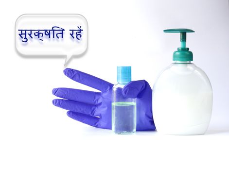 Protective face mask, soap, antiseptic, gloves against virus on white background. Stay Safe words in Indian HINDI language