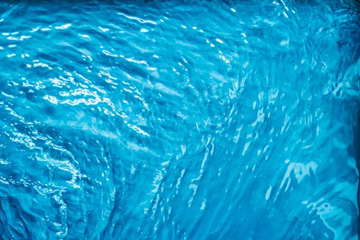 Blue water texture as abstract background, swimming pool and waves designs