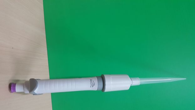 Micro pipettes, micro-chemical equipment placed on a green sheet