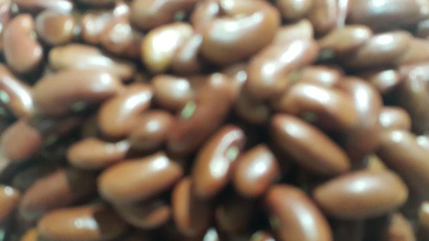 Kidenry beans:   Closeup view of uncooked red kidney beans. Dark red useful beans background.