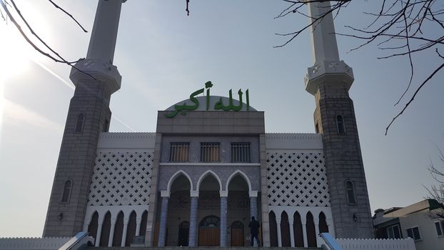 Seoul, South Korea - February 12, 2019:  Seoul Central Mosque, the first and biggest Islamic mosque in South Korea located in Itaewon Dong area. It has minerates and Letters with Allahu Akbar which means "Allah is the greatest".