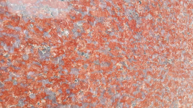 Reddish  floor abstract background:  Closeup texture of red concrete floor. A background of a red concrete or  wall in the sunshine.