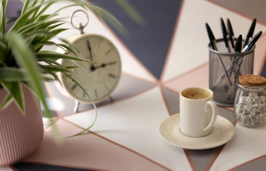 Home office place with stationery, cup of coffee on multicolor background. Home office working station concept