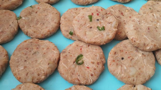 Spicy and tasty uncooked kebab stuffed with minced meat, onion,  alo paste and chana. Asian spicy cuisine.
