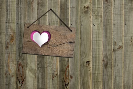 Antique rustic wooden sign board with paper heart hanging on old weathered fence background. Mock up, board concept. 3D illustartion