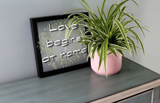 Sign quote Love begins at home on the background of black frame and home plant interior. Love, family concept