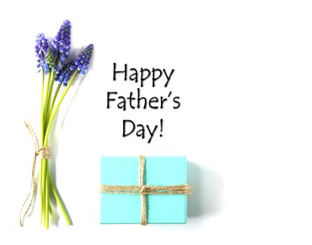 Happy Father's day massage with wrapped handmade gift box and blue flowers