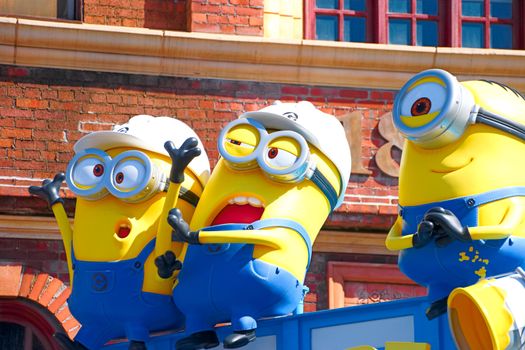 OSAKA, JAPAN - Nov 13, 2019 : Close up HAPPY MINION statue in Universal Studios Japan. Minions are famous character from Despicable Me animation.