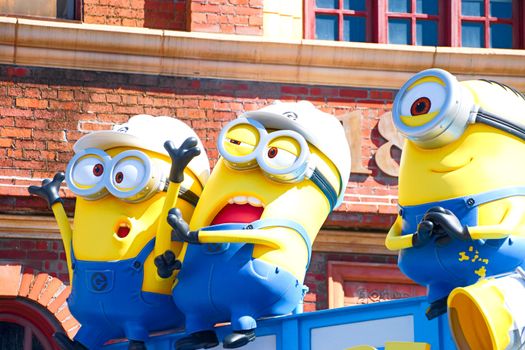 OSAKA, JAPAN - Nov 13, 2019 : Close up HAPPY MINION statue in Universal Studios Japan. Minions are famous character from Despicable Me animation.