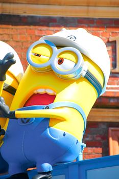 OSAKA, JAPAN - Nov 13, 2019 : Close up HAPPY MINION statue in Universal Studios Japan. Minions are famous character from Despicable Me animation.