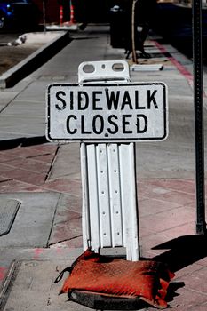 Sidewalk closed sign board.closing a sidewalk