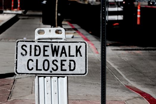 Sidewalk closed sign board.closing a sidewalk