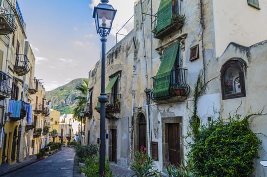 Typical neighborhood street on the island of lipari with its flowering pots and ancient constructions