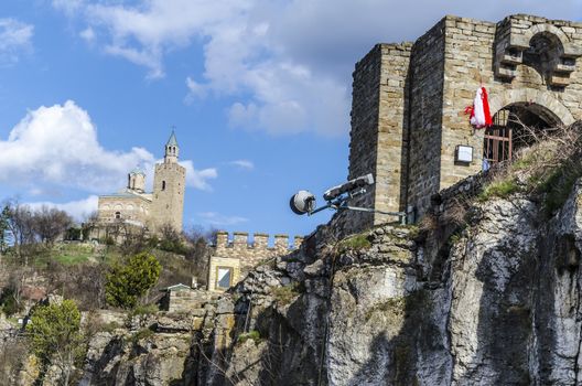 In the background is the cathedral of the Bulgarian city Veliko Tarnovo and to the right the entrance to the old fortress on the bank of Tsarevets here was the capital of the second Bulgarian Empire