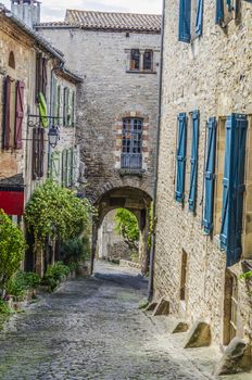 One of the medieval streets of the village of Cordes sur Ciel located in France in the midi pyrenees region