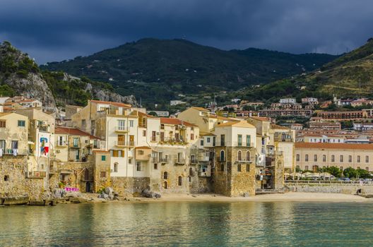 You will appreciate old houses at the foot of the beach in the coastal and seaside resort of Cefalu, island of Sicily near the city of Palermo