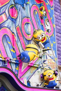 OSAKA, JAPAN - Nov 13, 2019 : Close up of HAPPY MINION statue in Universal Studios Japan. Minions are famous character from Despicable Me animation.