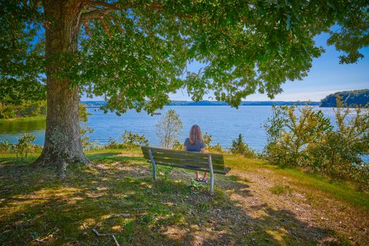 Women sitting on a bench enjoying the scenery of Kentucky Lake.