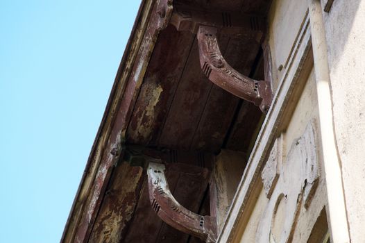 vintage wooden cornices on an ancient house close-up