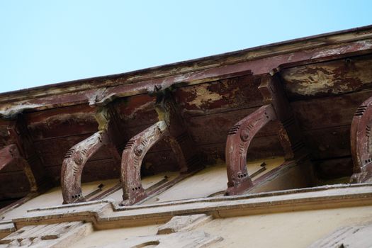 vintage wooden cornices on an ancient house close-up