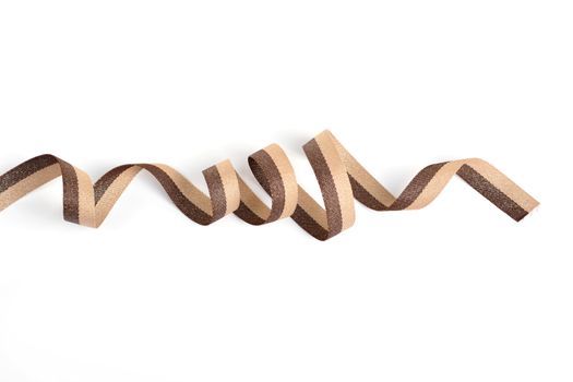 Brown beige Cotton ribbon, roll textilies on bobbin. strapping tape with curl on white backgroud. Use for sewing clothes, bags. Space for text.