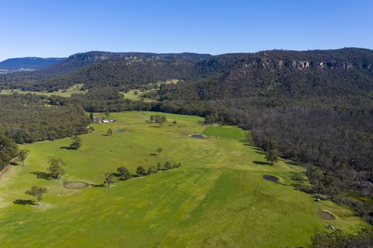 A lush green agricultural valley in The Blue Mountains in regional New South Wales in Australia