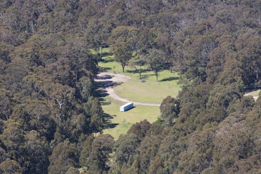 A large agricultural implement shed in a valley in the Central Tablelands in regional New South Wales in Australia