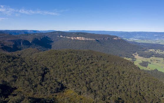 Aerial view of a large green valley at Mount Victoria in The Blue Mountains in New South Wales in Australia