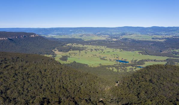 Aerial view of a large green valley at Mount Victoria in The Blue Mountains in New South Wales in Australia