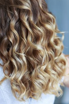 Women's curls in a professional wedding hairstyle.