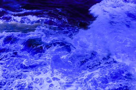 The ocean crashing on rocks with white waves in Kiama New South Wales taken in Infrared