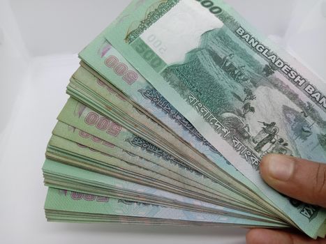 Bangladeshi 500 hundred bank note bundle on white background