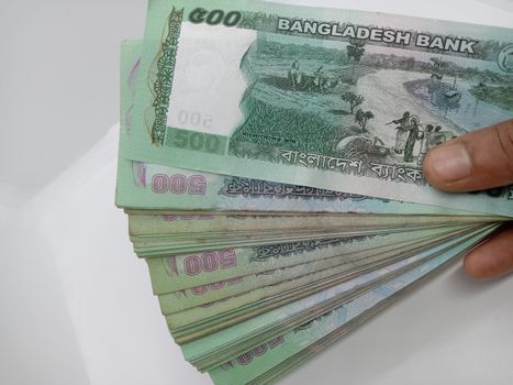 Bangladeshi 500 hundred bank note bundle on white background