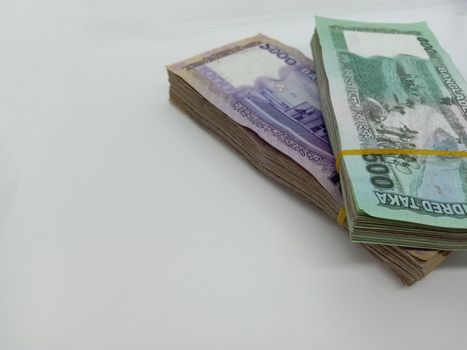 Bangladeshi bank note bundle on white background
