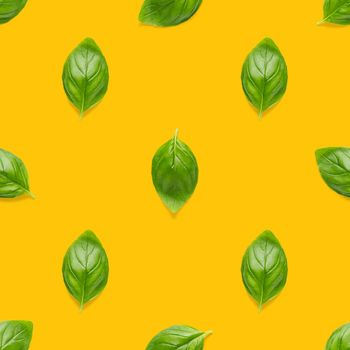 Italian Basil leaf herb seamless pattern on orange background, Creative seamless pattern made from fresh green basil flat lay layout. Food ingredient seamless pattern.