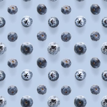 Trendy seamless pattern of blueberries. Blueberry pattern isolated on blue background. Blueberry flat lay, can be used for textile, prints, packing designs orother moden andcreative works