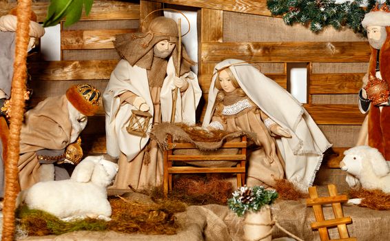 Christmas manger, Nativity scene, with the Jesus, Virgin Mary, Joseph, manger, straw, animals and magi who came, doll composition of the biblical story.