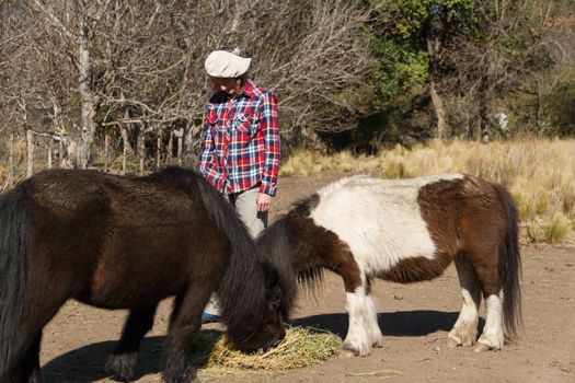 woman who works in the field with ponies