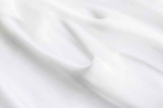 Pure white cream texture as abstract background, food substance or organic cosmetics