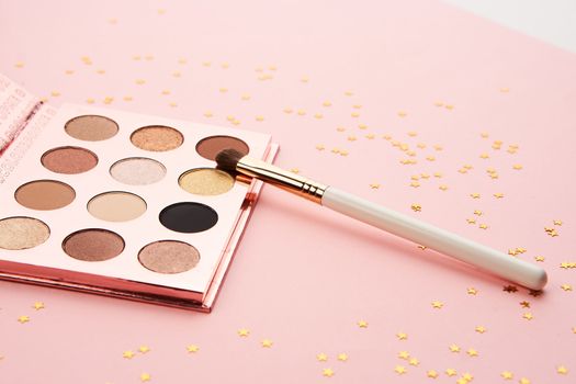 eyeshadow makeup brushes collection professional cosmetics accessories on pink background. High quality photo