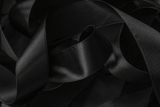 Black silk ribbon as background, abstract and luxury brand designs