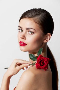 Woman with bare shoulders Red lips pure luxury skin makeup background