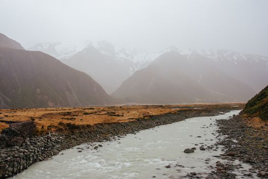Summer storm and flowing glacial river at Mt Cook in New Zealand