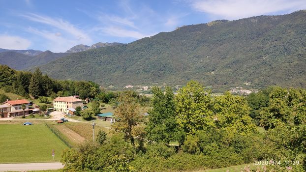 Val Gardena, Italy - 09/15/2020: Scenic alpine place with magical Dolomites mountains in background, amazing clouds and blue sky  in Trentino Alto Adige region, Italy, Europe