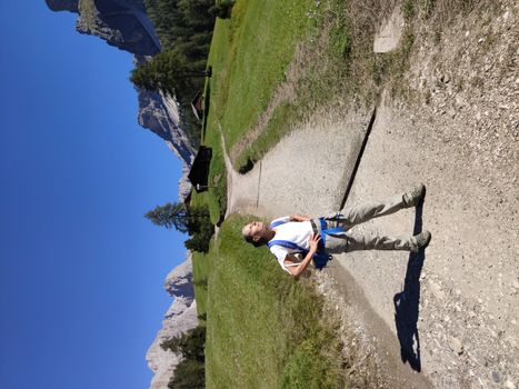 Val Gardena, Italy - 09/15/2020: Scenic alpine place with magical Dolomites mountains in background, amazing clouds and blue sky  in Trentino Alto Adige region, Italy, Europe