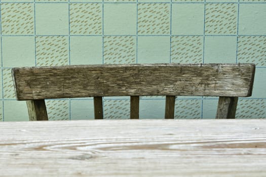 back of an old chair by the table, retro interior detail