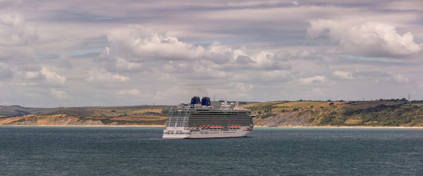 Weymouth Bay, United Kingdom - July 6, 2020: Beautiful panoramic shot of P&O cruise ship Britannia anchored in Weymouth Bay.