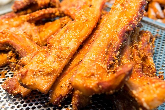 Fried pork belly with sesame seeds