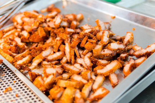 Fried pork belly with sesame seeds