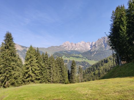 Val Gardena, Italy - 09/15/2020: Scenic alpine place with magical Dolomites mountains in background, amazing clouds and blue sky  in Trentino Alto Adige region, Italy, Europe